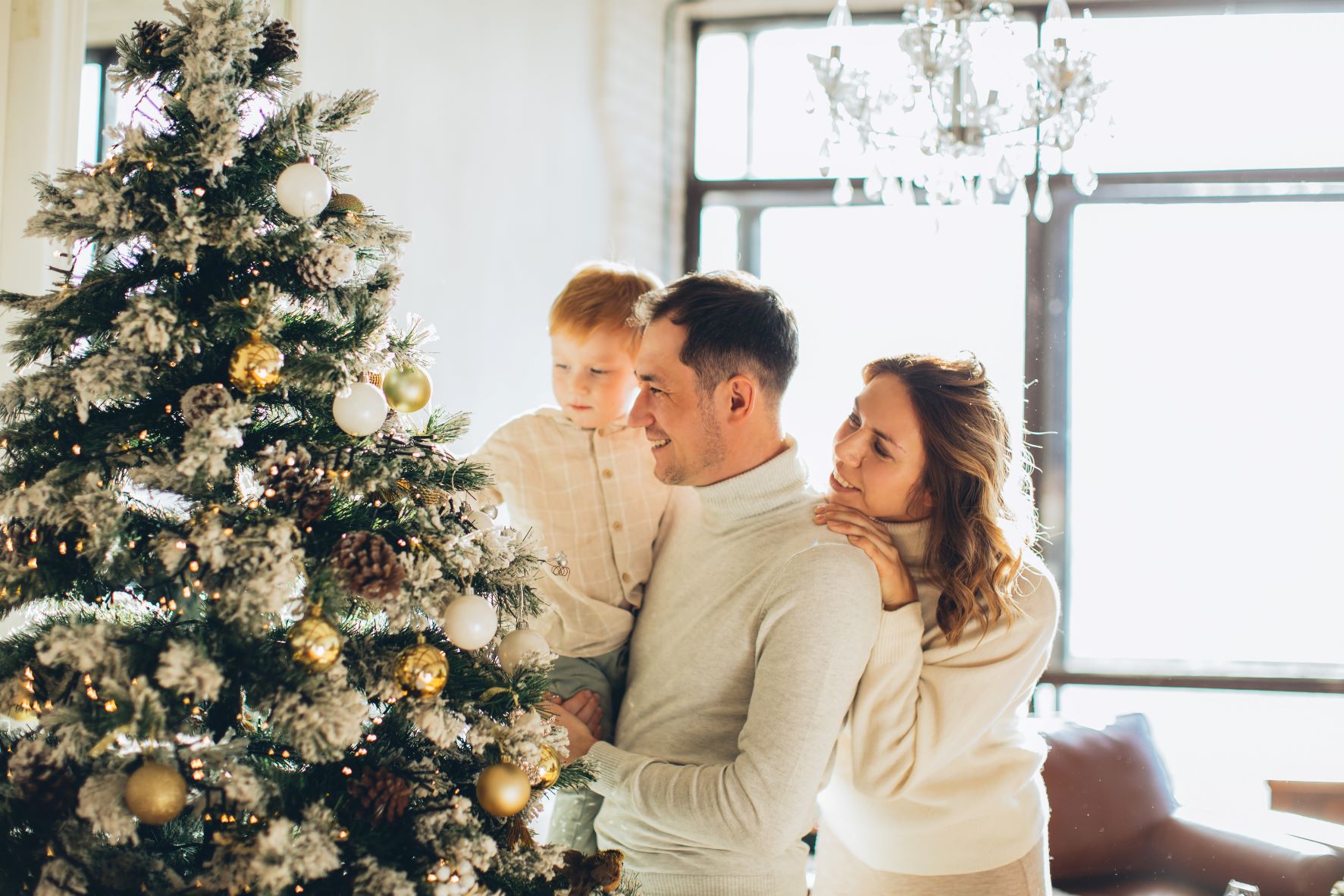 family-looking-at-christmas-tree