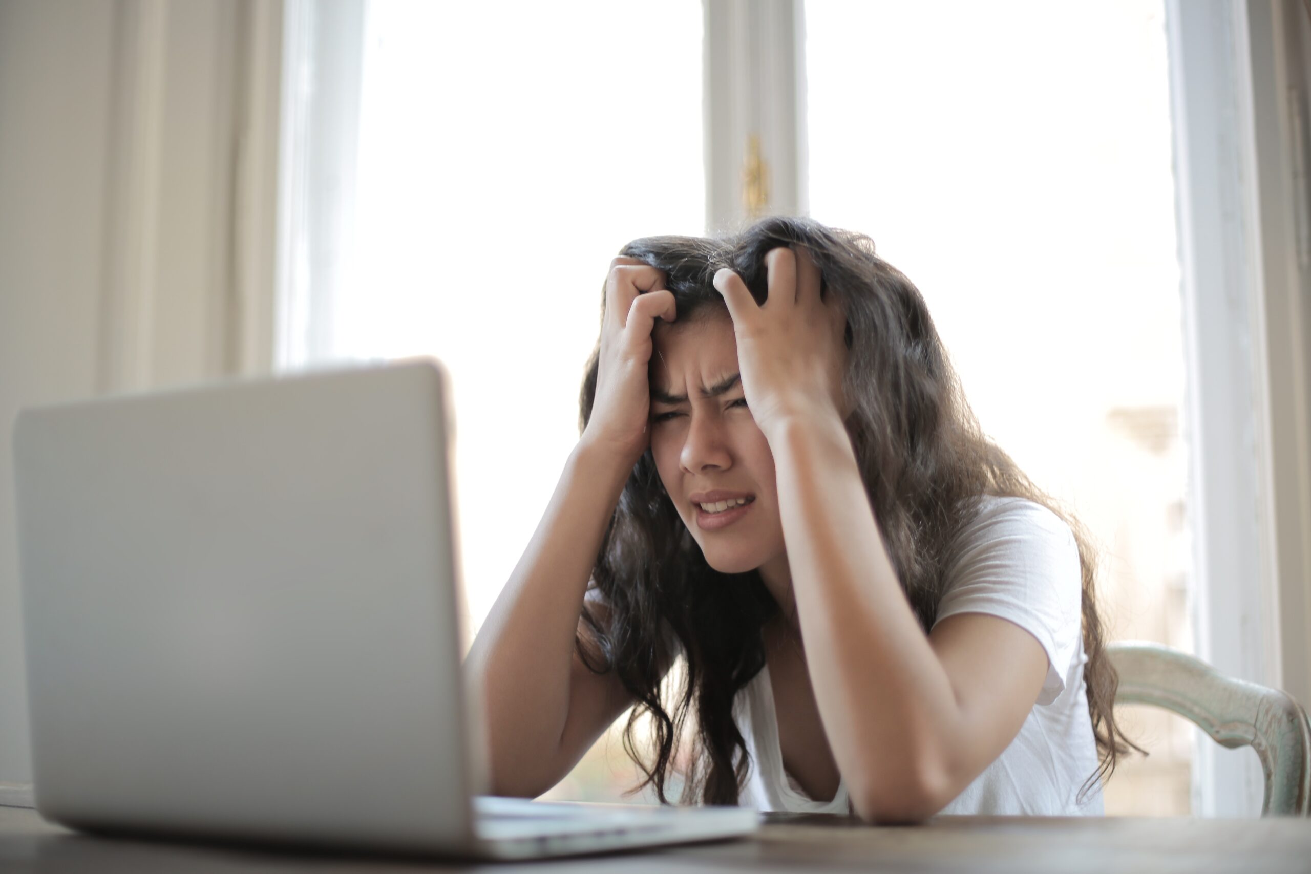 frustrated-woman-looking-at-laptop