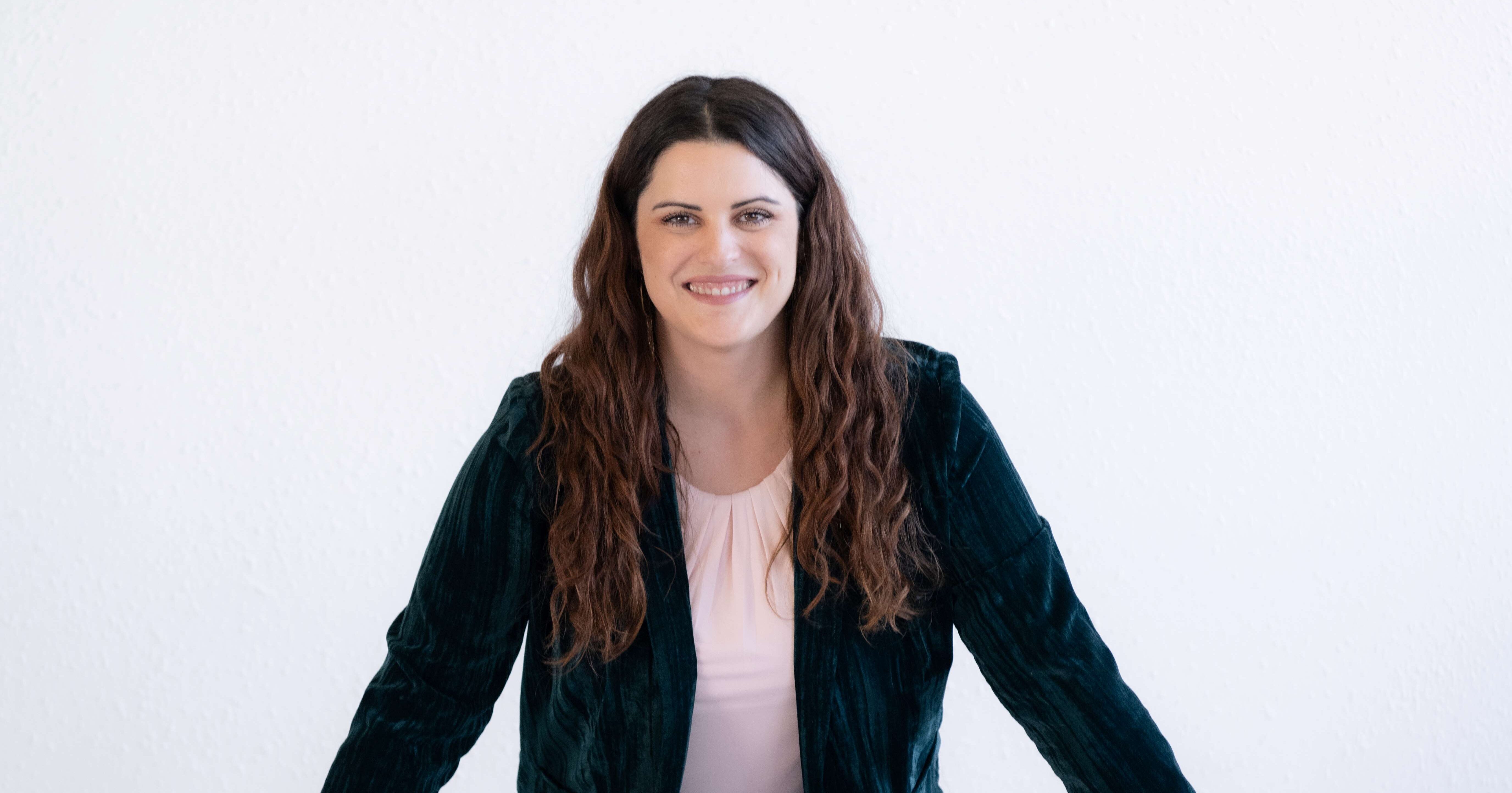 business-woman-standing-behind-couch